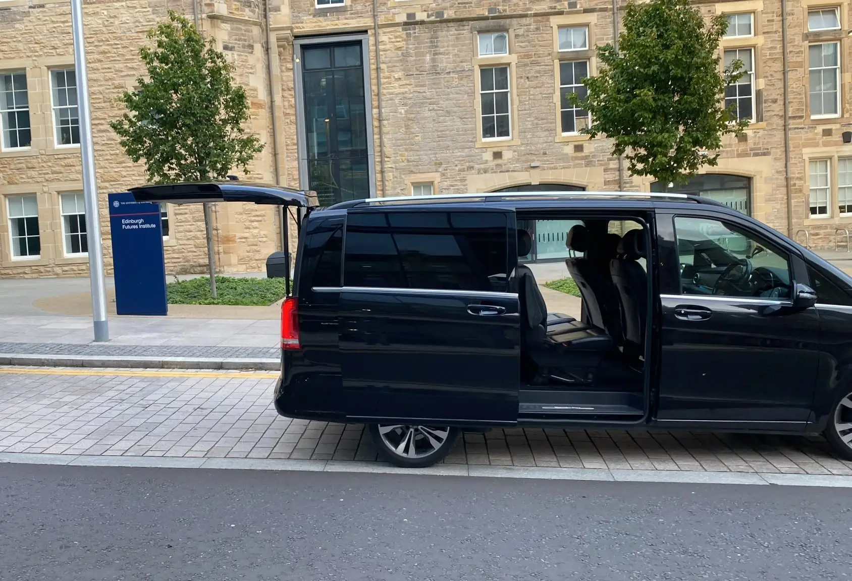 Mercedes V-Class with doors open ready for passengers
